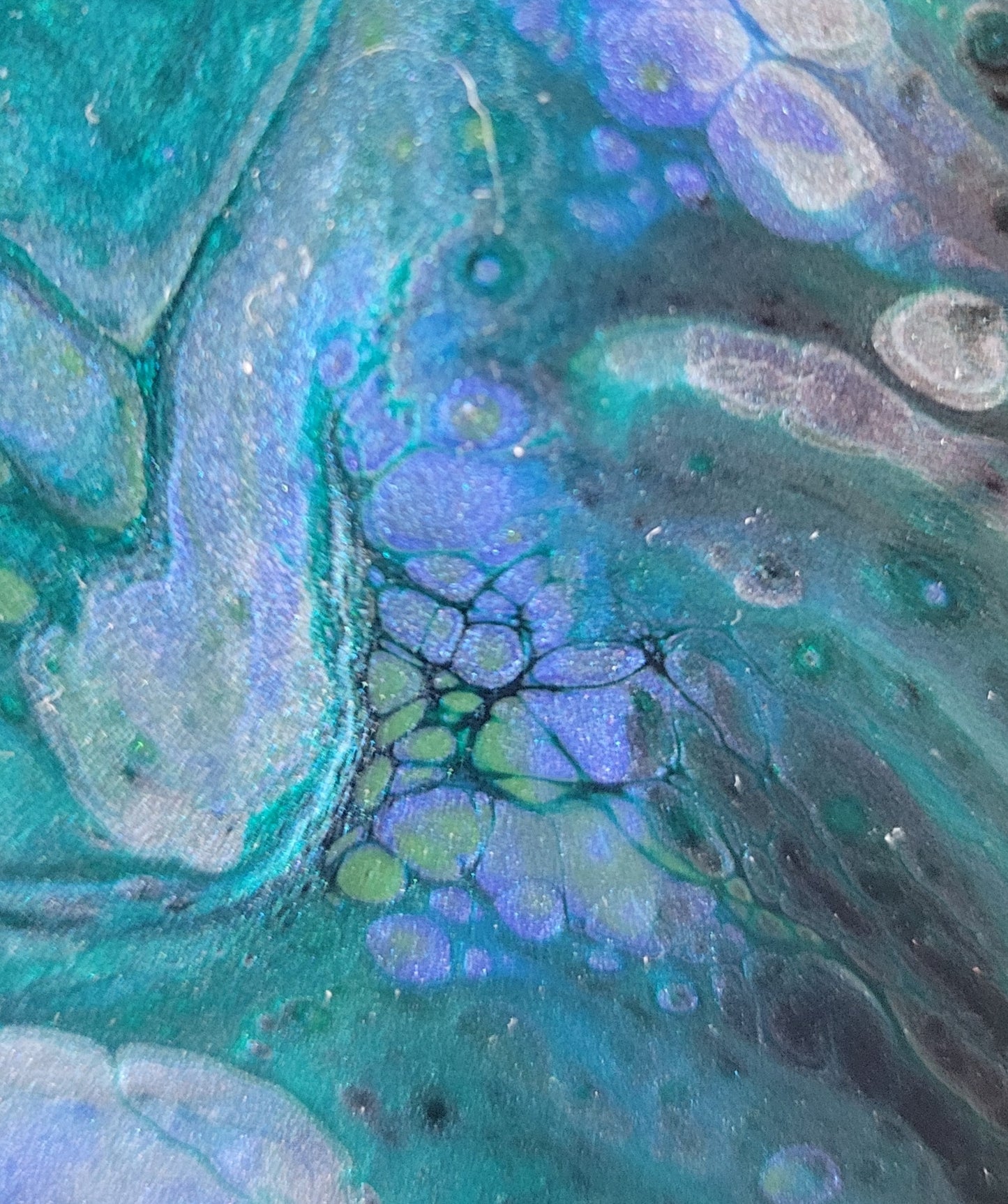 This highlighted portion of the tile focuses on the blues with some green bubbled and banding created in the fluid art process.