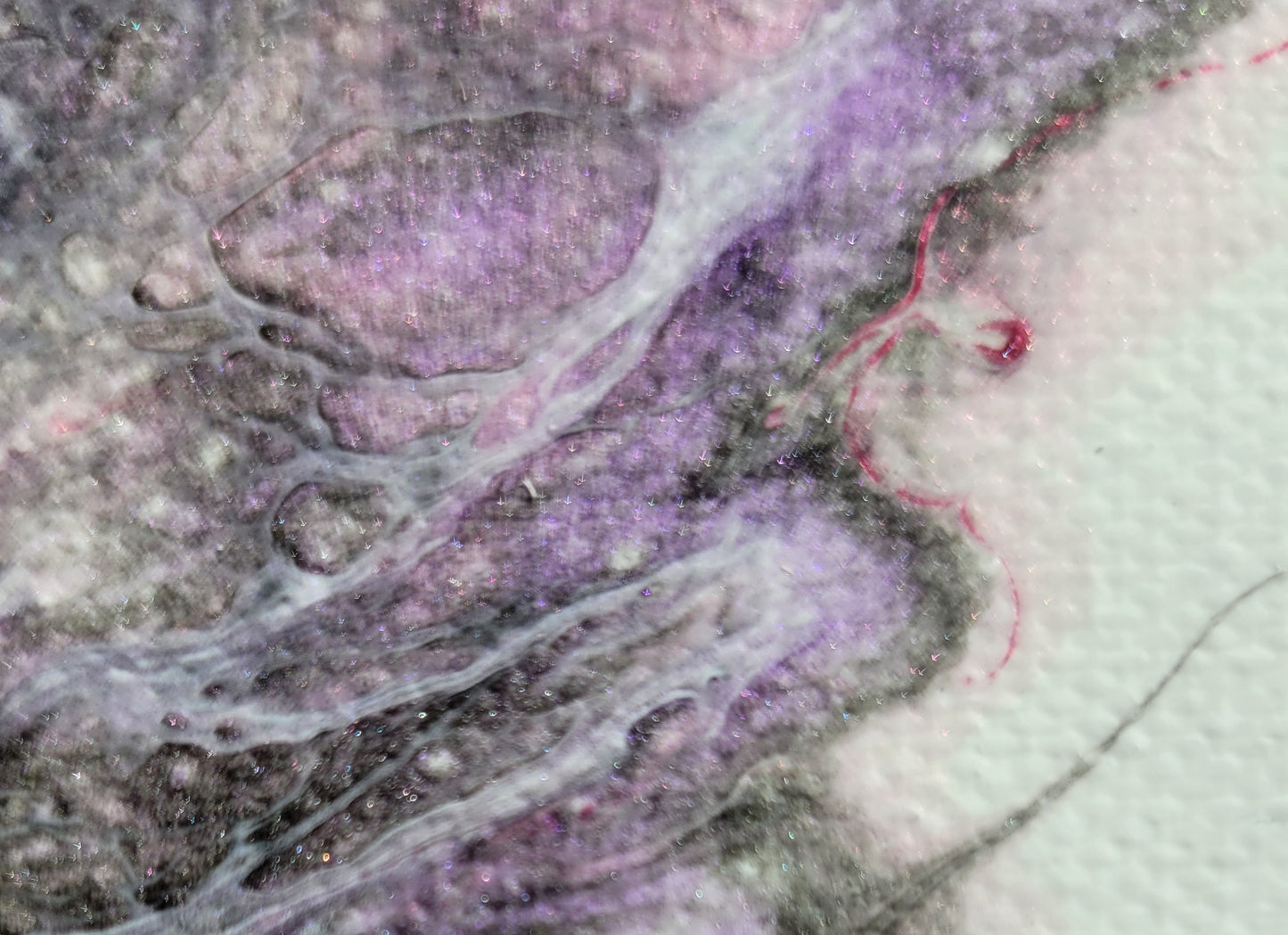 Close-up detail of one Carina Nebula I canvas, showing a thin thread of vibrant, sparkling pink bordering a band of dark gray as it encroached on the white canvas. Lacing of an off-white color bubbles and drapes over sparkling purple and gray-black.
