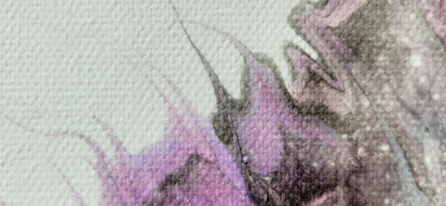Close-up detail of one of the Carina Nebula II canvases, showing sparkly wispy strands of pink, purple, and black reaching out into the white.