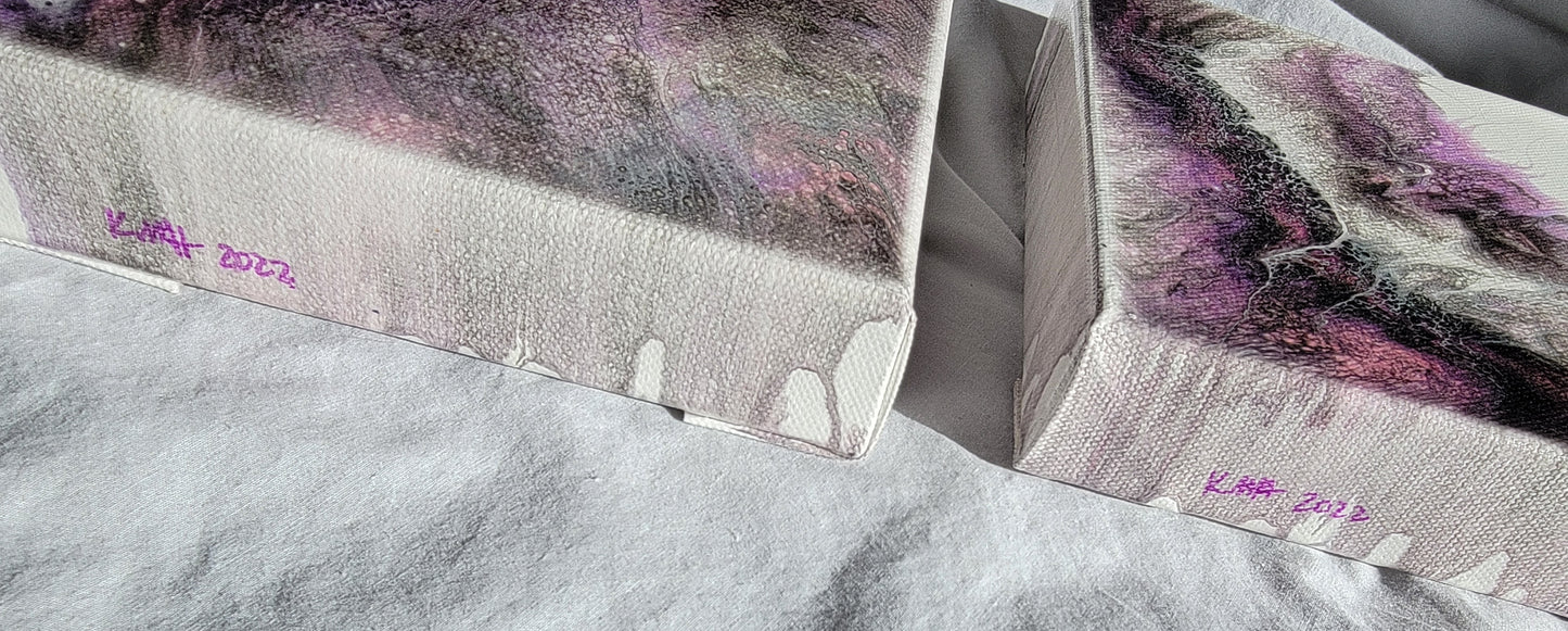 Side-on view of the two Carina Nebula II canvases, showing the artist's initials and year completed "KMH 2022".