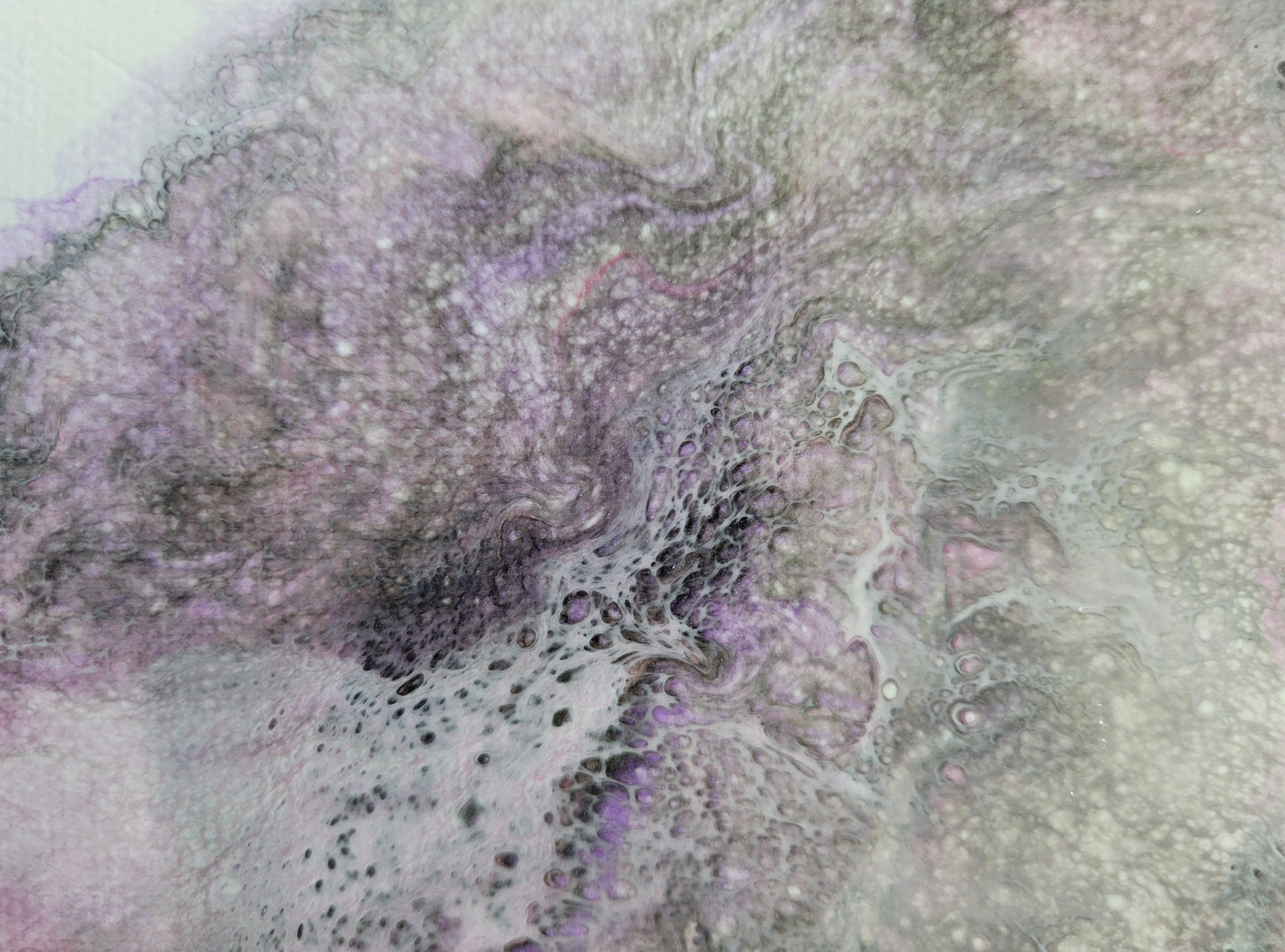Close-up detail of one Carina Nebula I canvases, showing gray lacing over black, purple, and pink, shadowed in such a way that the lacing looks like it's hovering over the other colors.