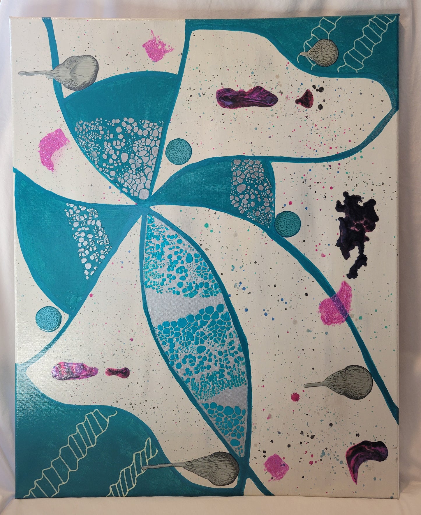 The dominant feature of the canvas is a cross-like figure in teal and silver. The teal lines that create the figure also extend to the edge of the canvas and create large areas painted teal with double-helical-style chains in off-white. The canvas background is a white and gray blend that is speckled with pinks and greens and blues. Turquoise and silver alkyd oil circles dot the canvas along with pink gel bead smudges and pink and purple dried acrylic patches.