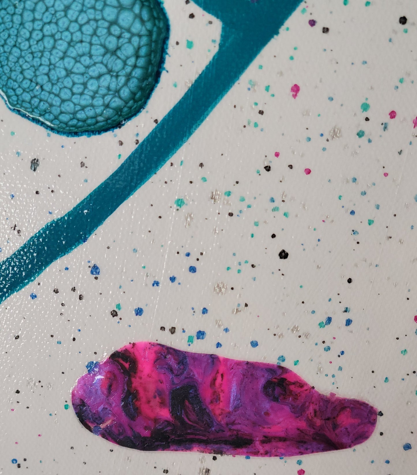 Close-up detail of a turquoise alkyd oil circle, a teal arcing line, and the pink-purple-black dried acrylic patch against a white canvas blue green, pink, black, and silver speckles.