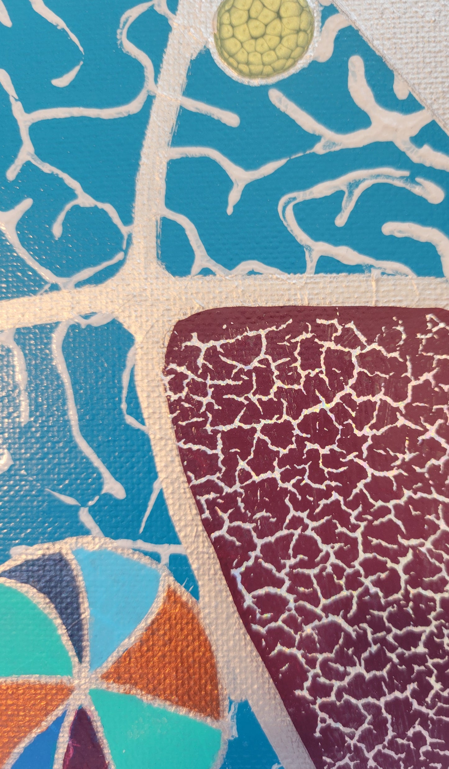 Details of the turquoise section, featuring a violet section with silver crackly foil. A multi-colored ball in coppers, blues, and purples can be seen.
