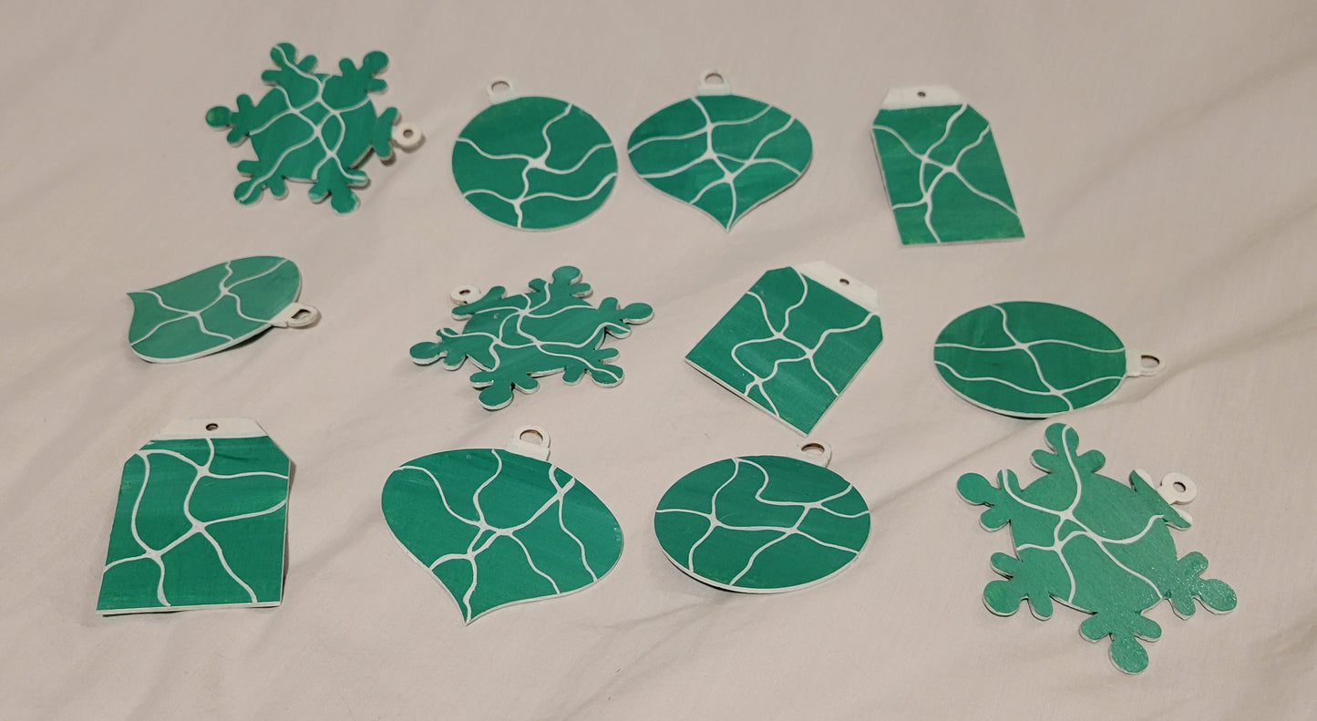 The array of all 12 ornaments (3 sets of 4), showing the unique neurographic line detailing against a more uniform bright green background.