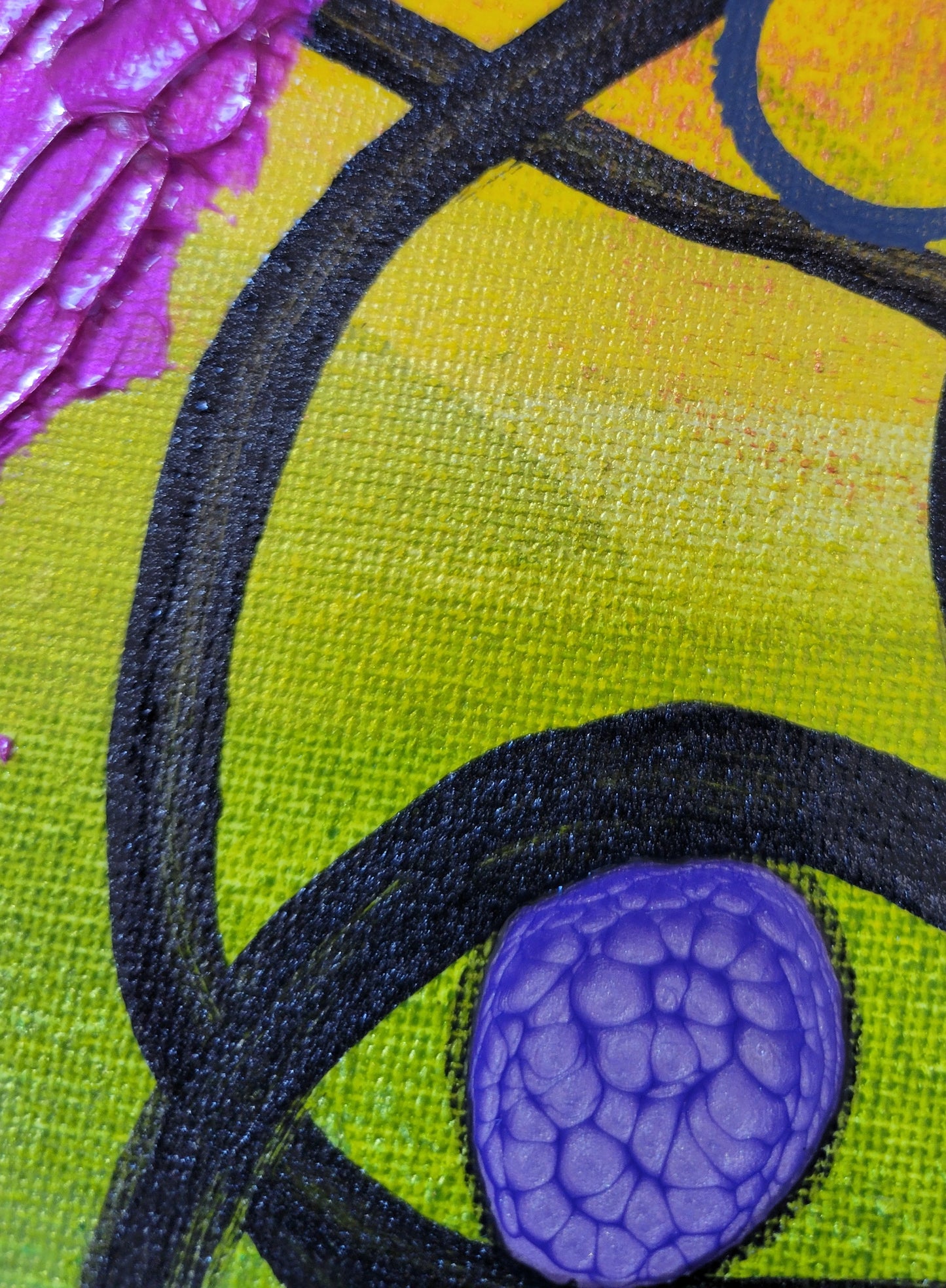 Close-up detail showing the gradient between the orange, yellow, and green with more textured brushwork visible in the black lines arcing through. The purple alkyd oil has a yellow undertone. A corner of the textured pink gel is visible, showing the peaks and valleys of the texturing work.