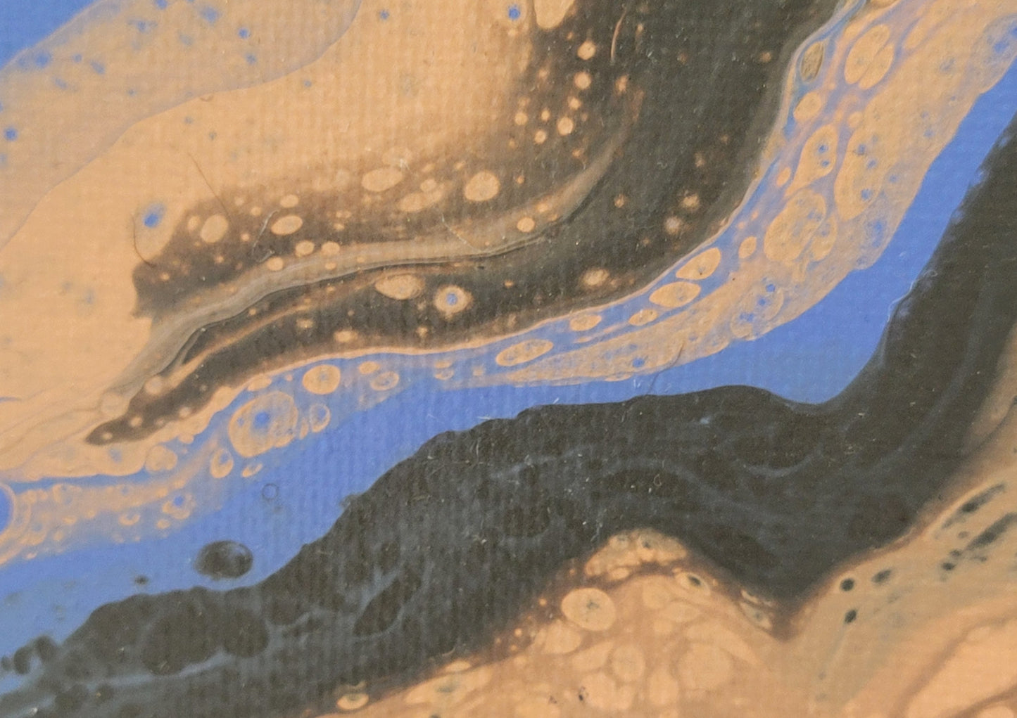 Close-up of the blue-violet side of the composition, showing the overlap, bubbling through, and streaking around of the gray and light pink.