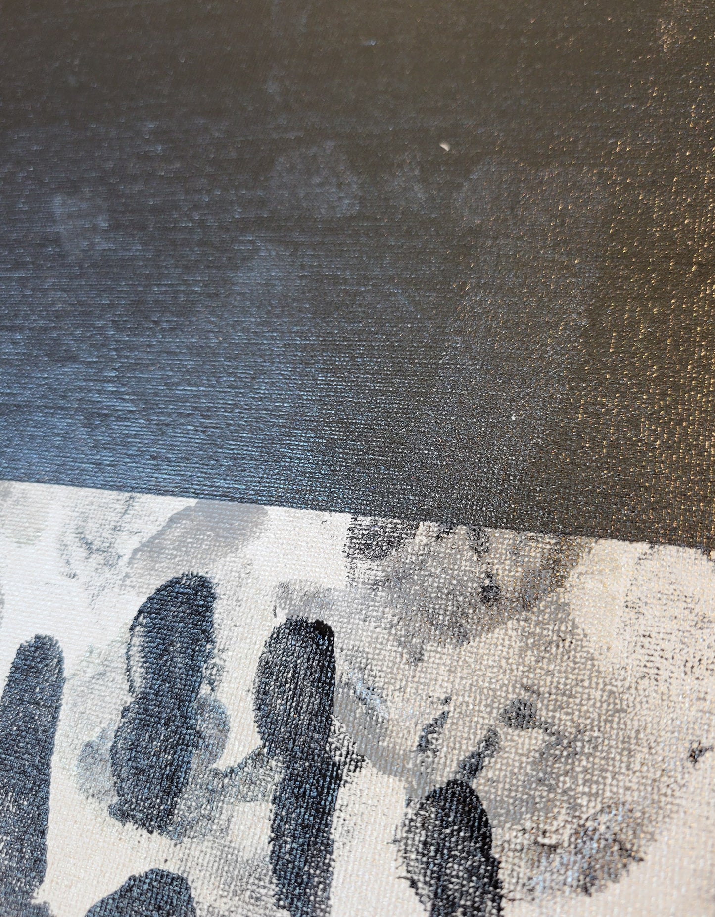 Close-up of the black band toward the base of the composition, with the glossy ghostly outline of a right hand print visible.