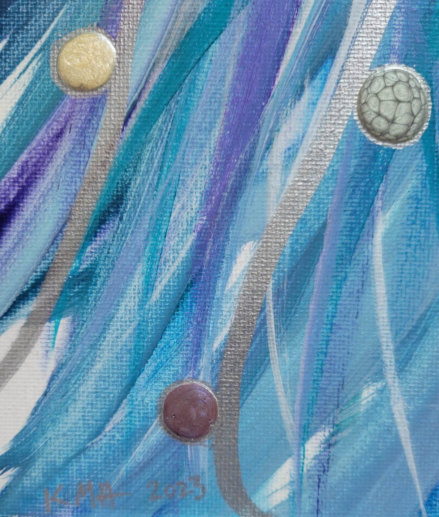 Closeup detail of the blue, purple, and teal lines brushing over and around each other. Silver lines overlay them all and drops of ivory, silver, and plum alkyd oil outlined in silver ride the silver lines. In the lower left corner the author's initials and year completed "KMH 2023" are written in silver.