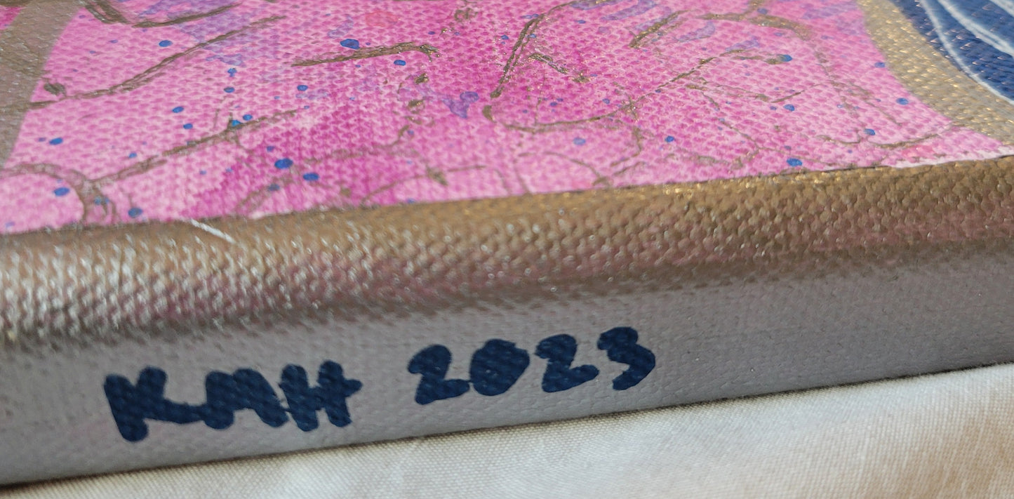 Close-up of the silver painted edge of the canvas with "KMH 2023" written thickly in dark blue.