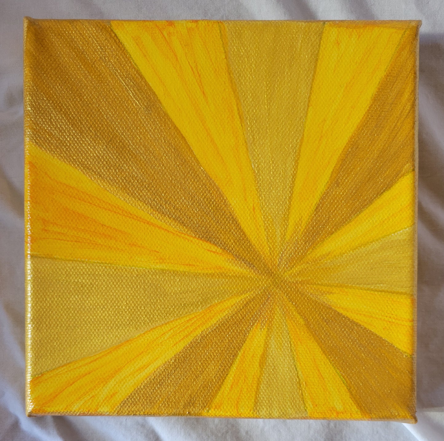 Triangular wedges radiate from a point to the lower right of center in shades of yellow, several of which have a patina of gold.