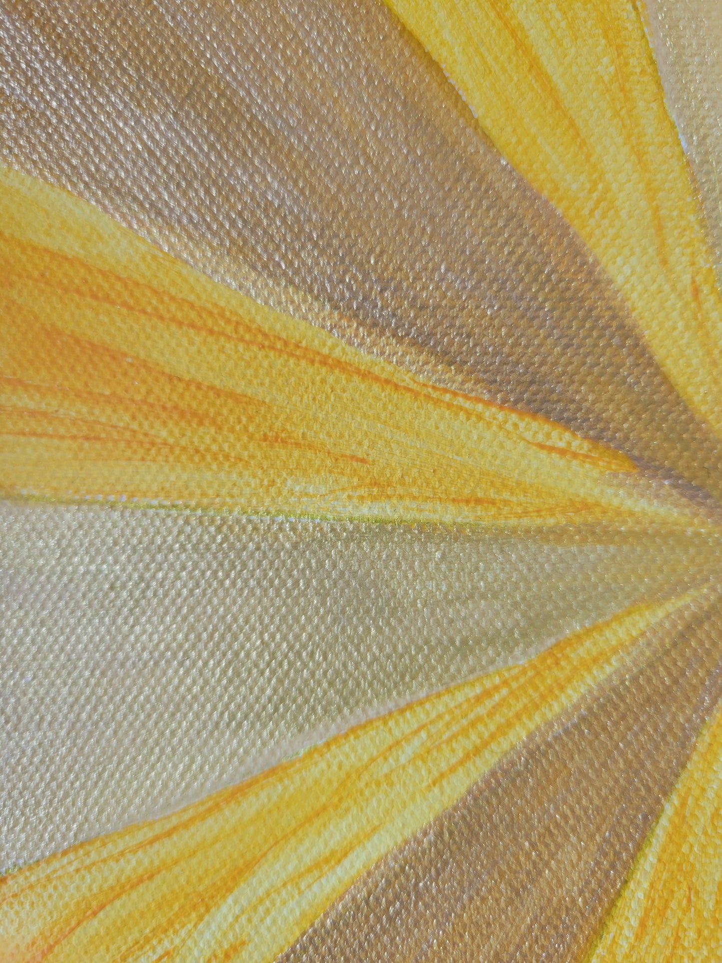 Closeup detail of the triangular wedges, showing the gold shading on the yellow ochre and pale yellow, interspersed with a vibrant mustard yellow that has darker streaks within it.