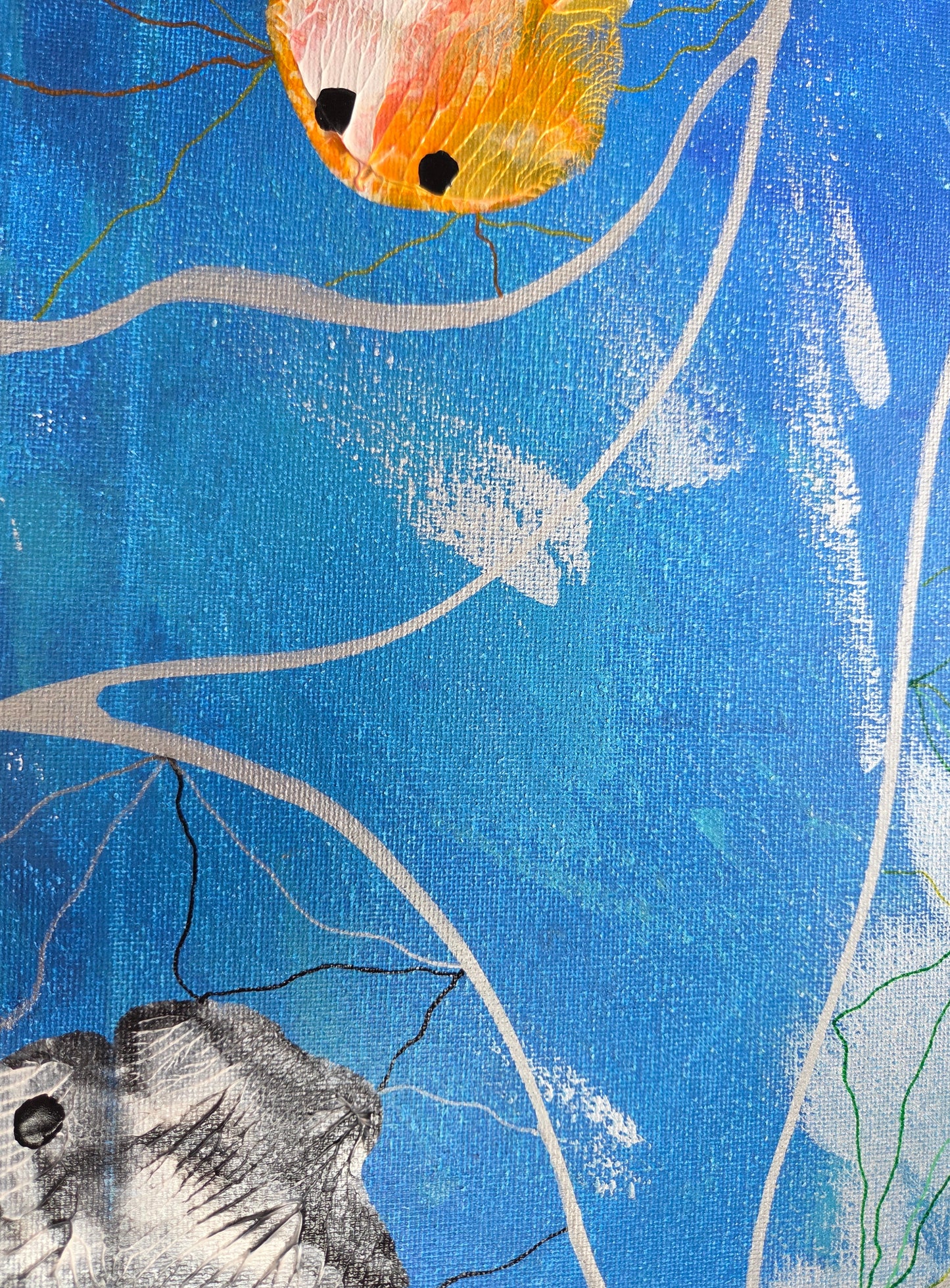 Close-up detail of the blue variegated sea with silver froth and current lines as the veiny orange and white koi radiates out lines if orange and yellow from the top while the veiny white and black zebrafish radiates out lines of silver and black from the bottom.