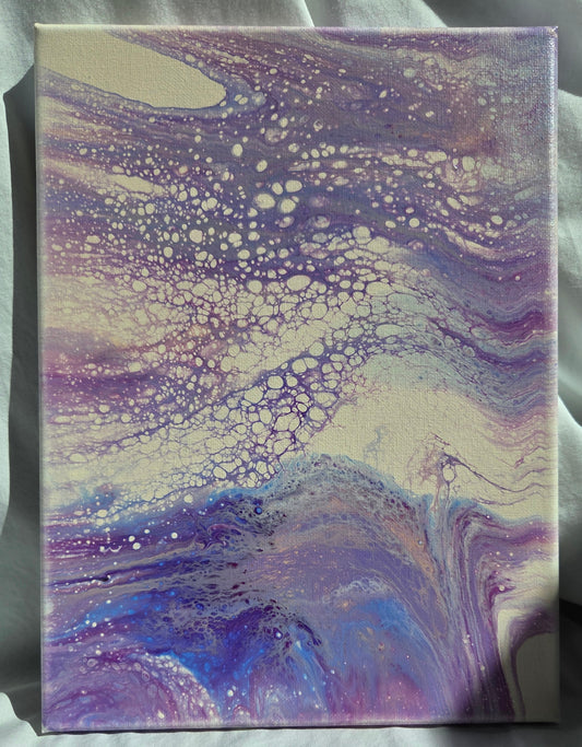 Fluid art piece with purples, blues, and pinks spill and tumble and froth over each other against a beige background.