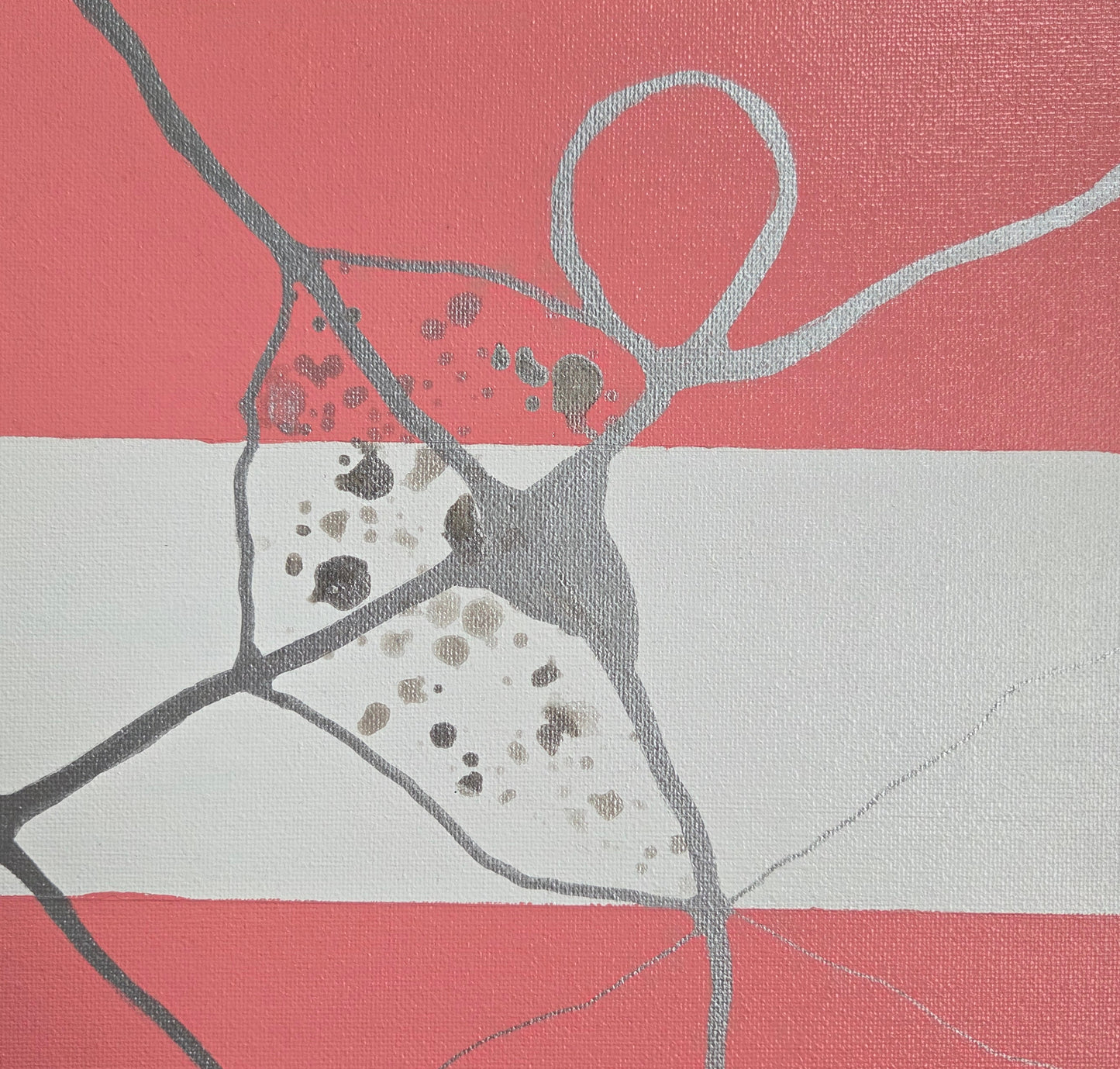 Close-up detail of the anatomical heart shape overlaid on the pink-white-pink bands of the trans pride flag. The heart shape is missing a section and otherwise speckled with large and small spots of silver ink.